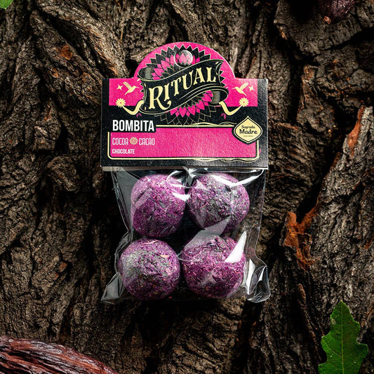 Packaged purple bath bombs with 'Ritual' branding on a tree bark background