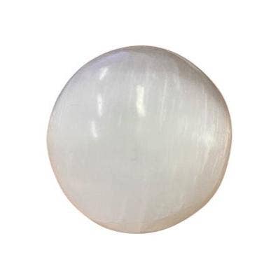 Selenite crystal sphere on a white background