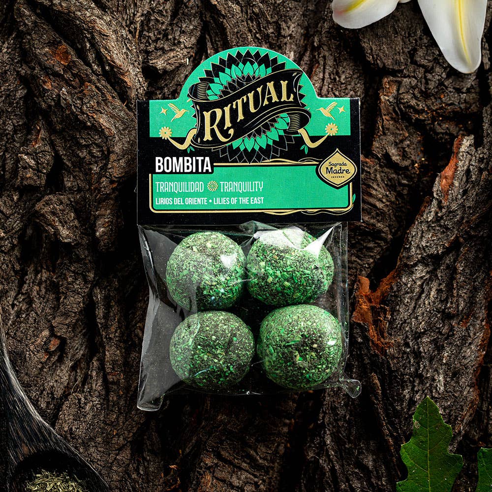 Packaged green balls with 'Ritual' label on a wooden background