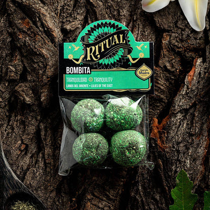 Packaged green balls with 'Ritual' label on a wooden background